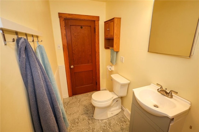 1265 Slippery Rock Rd, Liberty Twp, PA 16057 - half bathroom with vanity, toilet, and baseboards