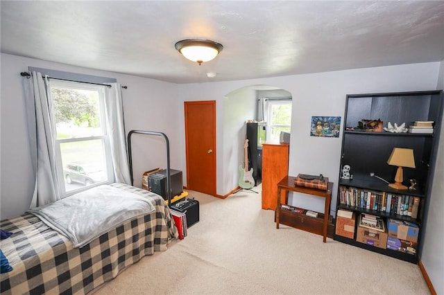 1265 Slippery Rock Rd, Liberty Twp, PA 16057 - bedroom with arched walkways, light colored carpet, and multiple windows