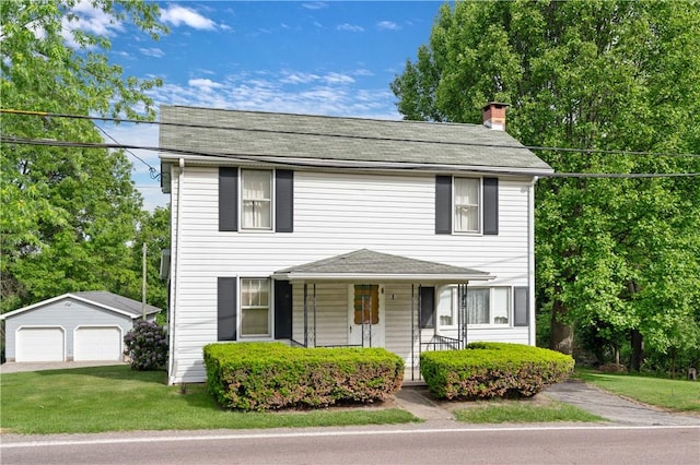 2265 State Route 982, Mount Pleasant Twp Wml, PA 15666 - view of front of house featuring a detached garage, an outbuilding, a chimney, a porch, and a front yard