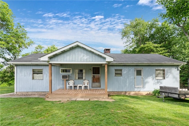 2265 State Route 982, Mount Pleasant Twp Wml, PA 15666 - back of property with a porch, a lawn, and a chimney