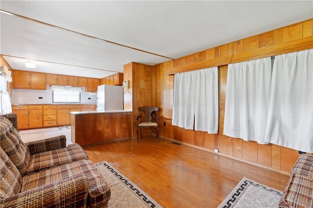 2265 State Route 982, Mount Pleasant Twp Wml, PA 15666 - living room featuring light wood finished floors and wood walls