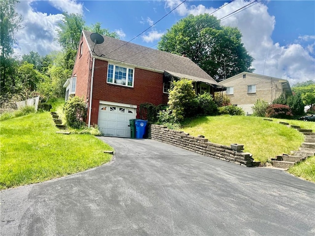 535 Glen Shannon Dr, Castle Shannon, PA 15234 - view of front facade featuring brick siding, an attached garage, driveway, a front yard, and stairway