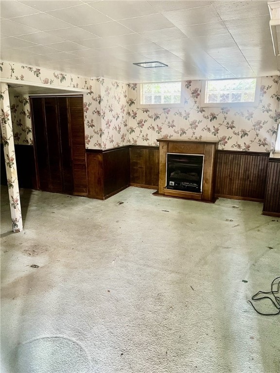 535 Glen Shannon Dr, Castle Shannon, PA 15234 - unfurnished living room with wallpapered walls, a wainscoted wall, carpet flooring, and a fireplace