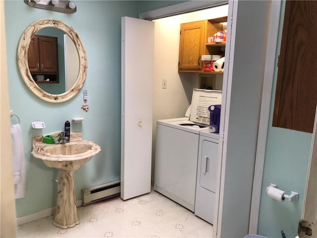 1 S Main St, Fairchance, PA 15437 - washroom with washer and clothes dryer, a baseboard radiator, cabinet space, light floors, and baseboards
