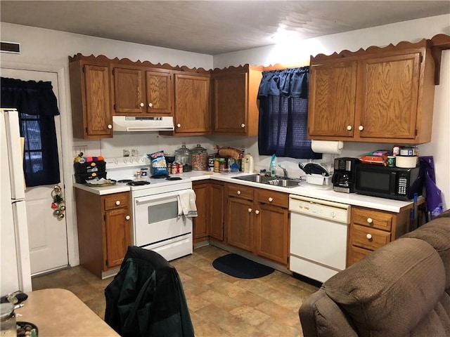 1 S Main St, Fairchance, PA 15437 - kitchen featuring white appliances, a sink, under cabinet range hood, light countertops, and brown cabinets