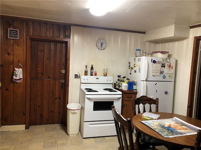 1 S Main St, Fairchance, PA 15437 - kitchen featuring white appliances and wooden walls