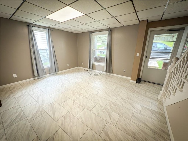 126 W Boyd Ave, City Of But Se, PA 16001 - spare room with plenty of natural light, a paneled ceiling, and baseboards