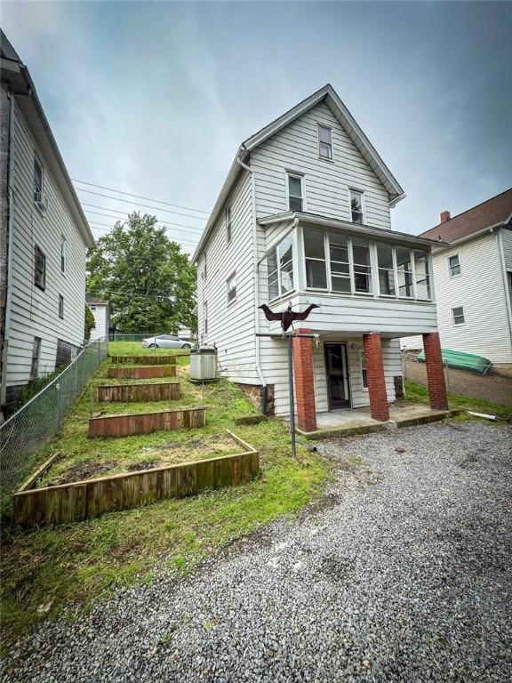 126 W Boyd Ave, City Of But Se, PA 16001 - view of front of property with a sunroom, driveway, and cooling unit