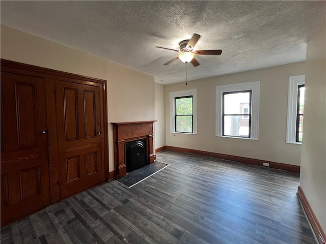 167 S 15th St, South Side, PA 15203 - unfurnished living room with dark wood finished floors, ceiling fan, baseboards, and a textured ceiling