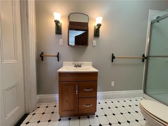 167 S 15th St, South Side, PA 15203 - bathroom featuring tile patterned floors, a shower stall, vanity, and baseboards