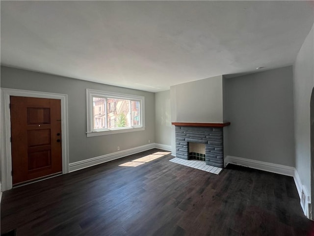 167 S 15th St, South Side, PA 15203 - unfurnished living room featuring baseboards, dark wood-style floors, and a fireplace