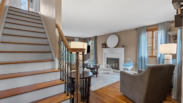 4720 Rolling Hills Rd, Whitehall, PA 15236 - living area with a high end fireplace, wood finished floors, and stairway