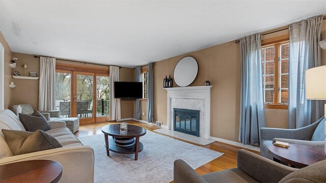 4720 Rolling Hills Rd, Whitehall, PA 15236 - living area featuring a high end fireplace, wood finished floors, and baseboards