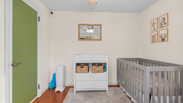 4720 Rolling Hills Rd, Whitehall, PA 15236 - bedroom featuring wood finished floors, a crib, and baseboards