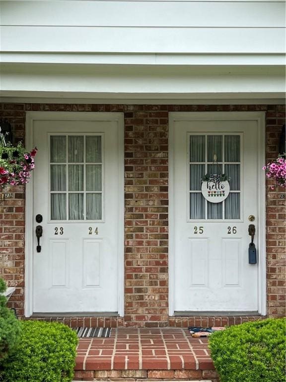 286 Windsor Rdg Unit 26, Neshannock Twp, PA 16105 - property entrance featuring a porch and brick siding