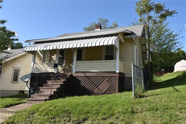 1020 Arch St, City Of Washington, PA 15301 - bungalow-style house featuring a porch, a chimney, a front lawn, stairs, and roof with shingles