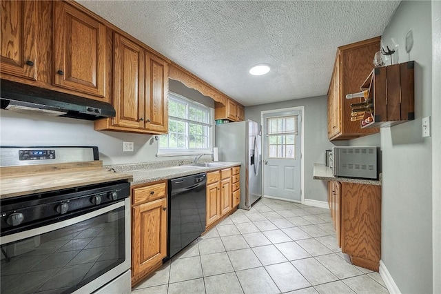 216 Siebert, Ross Twp, PA 15237 - kitchen with appliances with stainless steel finishes, under cabinet range hood, a sink, light countertops, and brown cabinetry