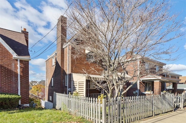 2238 Lucina Ave, Overbrook, PA 15210 - view of home's exterior with a fenced front yard and brick siding