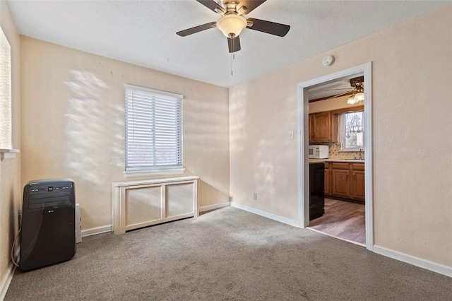 2238 Lucina Ave, Overbrook, PA 15210 - unfurnished bedroom with carpet floors, a sink, baseboards, ensuite bath, and ceiling fan