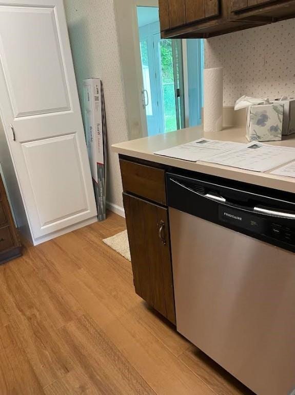 241 Willow Dr, Monroeville, PA 15146 - kitchen featuring stainless steel dishwasher, light countertops, light wood finished floors, and dark brown cabinetry