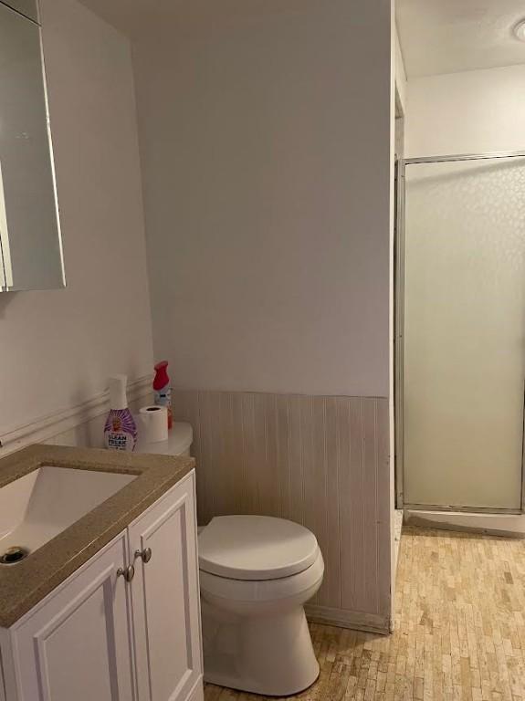 241 Willow Dr, Monroeville, PA 15146 - bathroom featuring a shower stall, vanity, and wainscoting