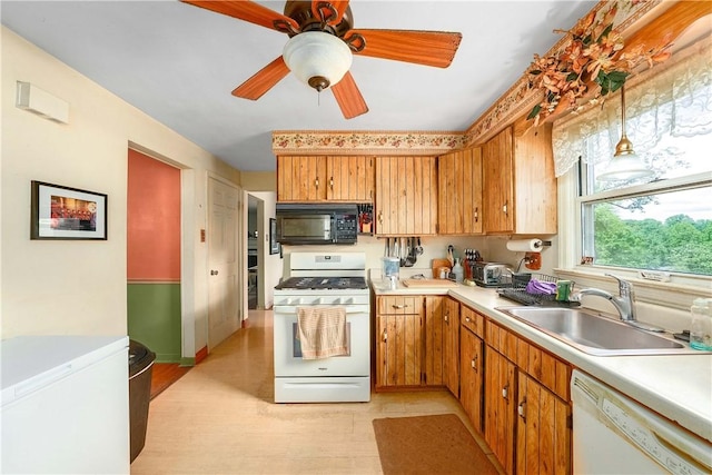 3329 Forest Rd, Bethel Park, PA 15102 - kitchen featuring white appliances, a sink, light countertops, ceiling fan, and brown cabinetry