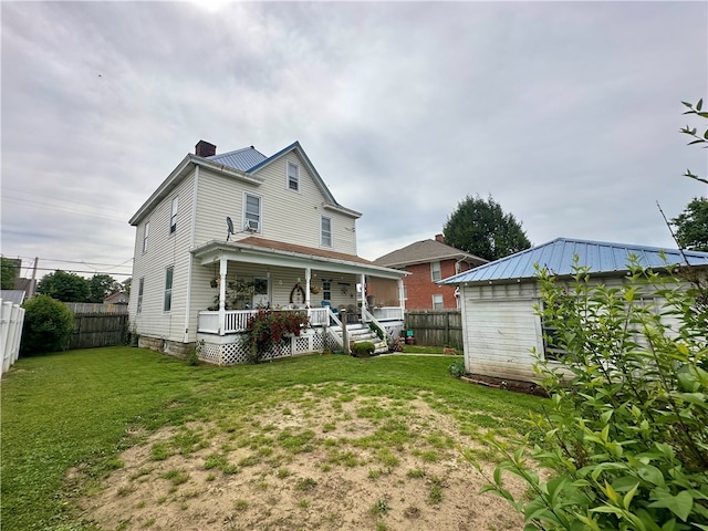 453 N W St, Waynsbrg/Frankln Twp, PA 15370 - rear view of house featuring covered porch, a chimney, and metal roof