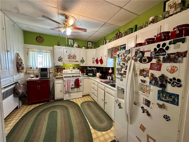 453 N W St, Waynsbrg/Frankln Twp, PA 15370 - kitchen with white appliances, under cabinet range hood, a ceiling fan, light flooring, and white cabinetry