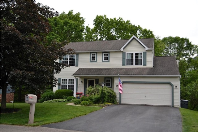 319 Hummingbird Cir, Cranberry Twp, PA 16066 - view of front of house with driveway and a front lawn