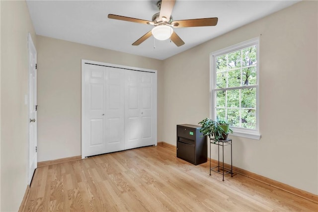 319 Hummingbird Cir, Cranberry Twp, PA 16066 - bedroom featuring light wood-style floors, multiple windows, baseboards, and a closet