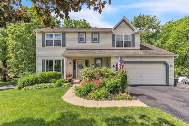 319 Hummingbird Cir, Cranberry Twp, PA 16066 - traditional-style house featuring a front lawn, driveway, a garage, and a shingled roof