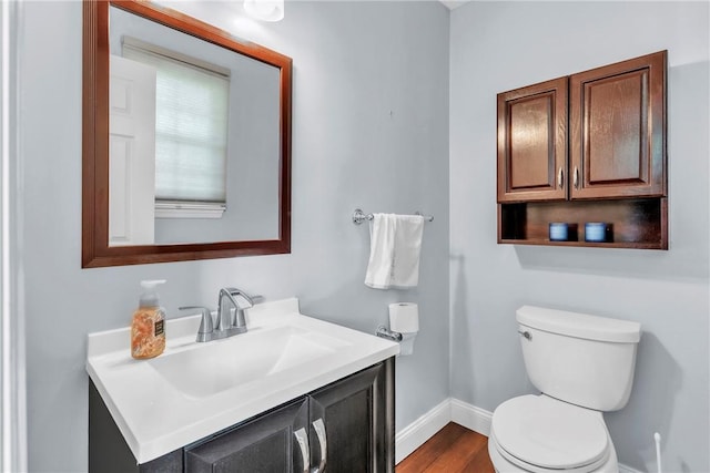 319 Hummingbird Cir, Cranberry Twp, PA 16066 - half bath with baseboards, toilet, vanity, and wood finished floors