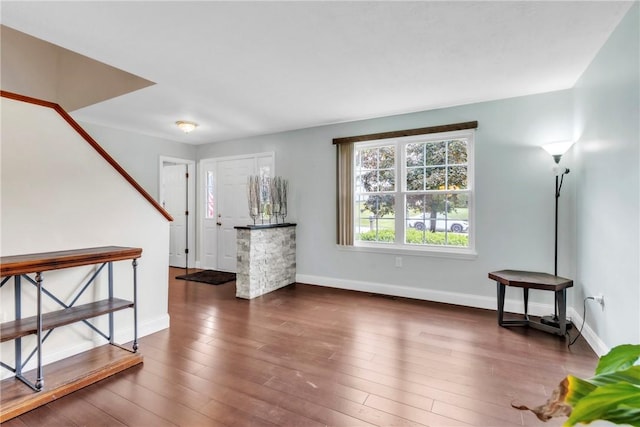 319 Hummingbird Cir, Cranberry Twp, PA 16066 - unfurnished living room with baseboards and wood finished floors