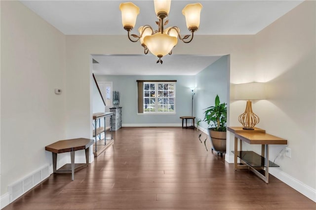 319 Hummingbird Cir, Cranberry Twp, PA 16066 - entryway featuring a chandelier, wood finished floors, and baseboards
