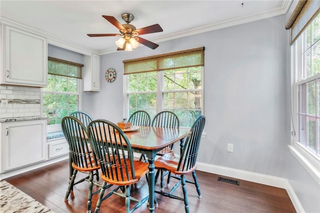 319 Hummingbird Cir, Cranberry Twp, PA 16066 - dining area with healthy amount of natural light, dark wood-style flooring, baseboards, and crown molding