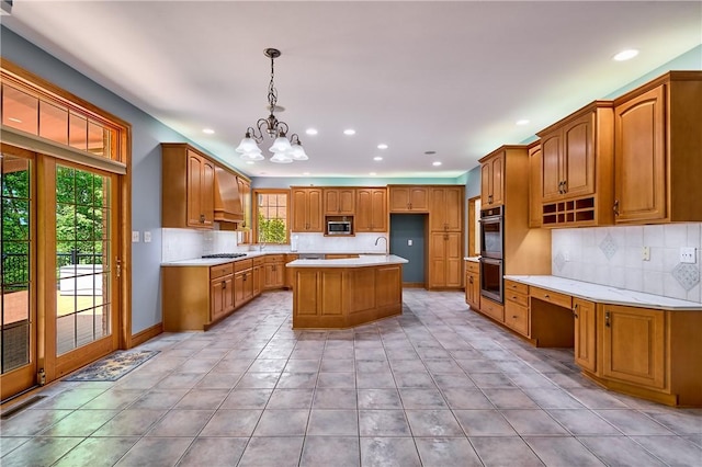 133 Ridgemont Dr, Cranberry Twp, PA 16066 - kitchen with appliances with stainless steel finishes, recessed lighting, a chandelier, light countertops, and a center island with sink