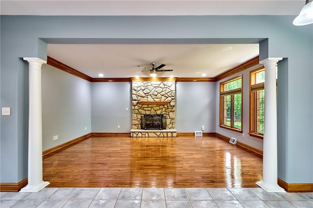 133 Ridgemont Dr, Cranberry Twp, PA 16066 - unfurnished living room with a ceiling fan, tile patterned flooring, a fireplace, ornamental molding, and baseboards
