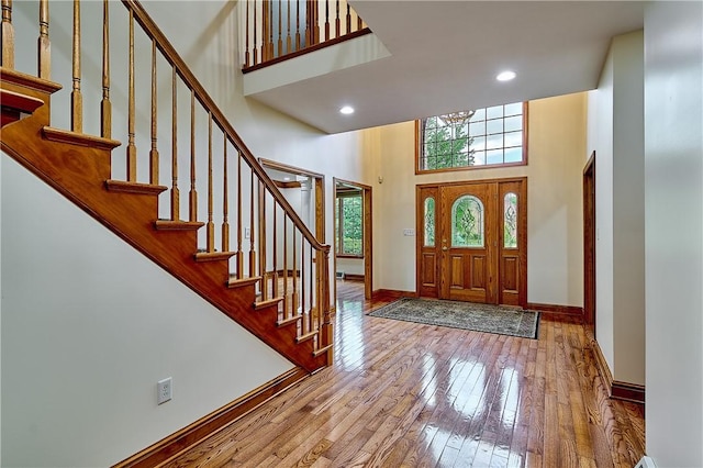 133 Ridgemont Dr, Cranberry Twp, PA 16066 - foyer with a high ceiling, hardwood / wood-style floors, baseboards, stairs, and recessed lighting