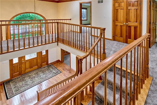 133 Ridgemont Dr, Cranberry Twp, PA 16066 - staircase featuring baseboards, crown molding, hardwood / wood-style flooring, and carpet floors