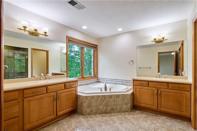133 Ridgemont Dr, Cranberry Twp, PA 16066 - bathroom featuring a bath, two vanities, tile patterned flooring, tiled shower, and recessed lighting