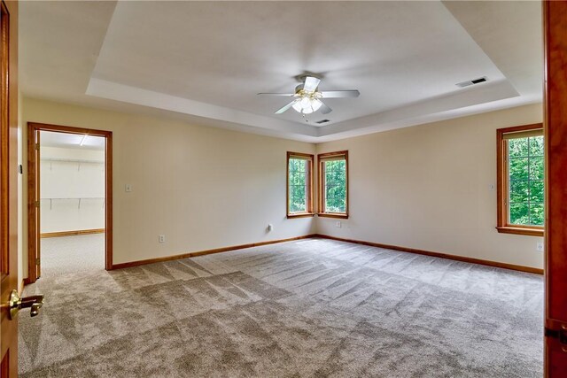 133 Ridgemont Dr, Cranberry Twp, PA 16066 - empty room with a raised ceiling, a ceiling fan, and carpet