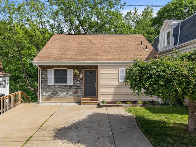 48 Glenmore Ave, West View, PA 15229 - view of front of home with roof with shingles and a front lawn