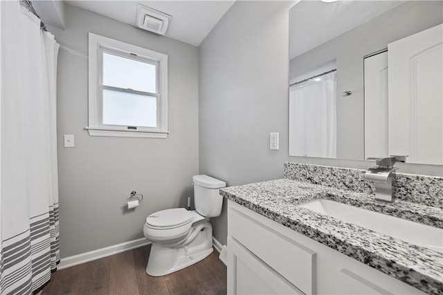 48 Glenmore Ave, West View, PA 15229 - bathroom featuring baseboards, toilet, vanity, and wood finished floors