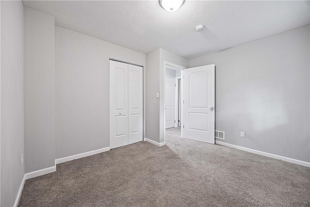 48 Glenmore Ave, West View, PA 15229 - unfurnished bedroom with carpet flooring, baseboards, a closet, and a textured ceiling