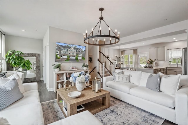 436 Greenwood Dr, North Strabane, PA 15317 - living area with a chandelier, stairway, wood finished floors, baseboards, and recessed lighting
