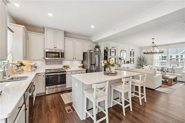 436 Greenwood Dr, North Strabane, PA 15317 - kitchen with stainless steel appliances, a sink, dark wood-style flooring, light countertops, and recessed lighting