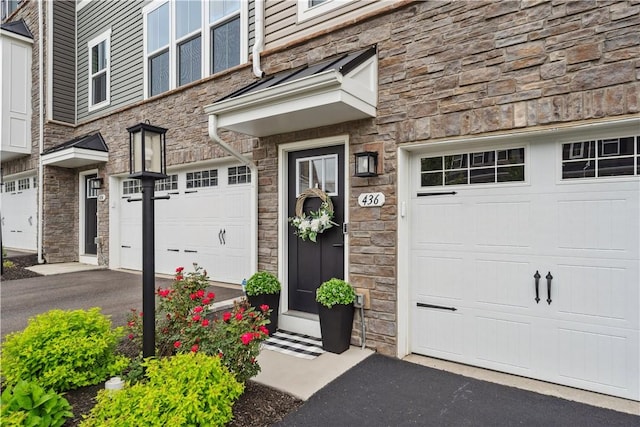 436 Greenwood Dr, North Strabane, PA 15317 - entrance to property featuring an attached garage, stone siding, and driveway