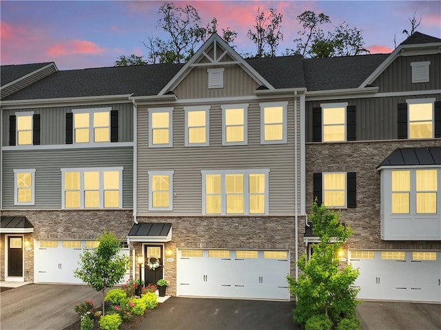 436 Greenwood Dr, North Strabane, PA 15317 - multi unit property with stone siding, board and batten siding, an attached garage, and driveway