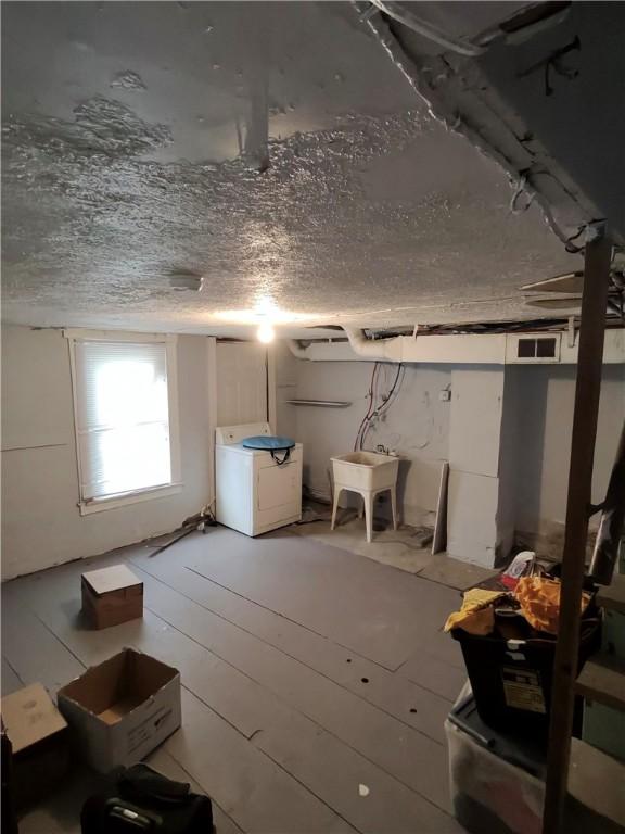 332 Hammond St, Sheraden, PA 15204 - basement with washer / dryer and a sink