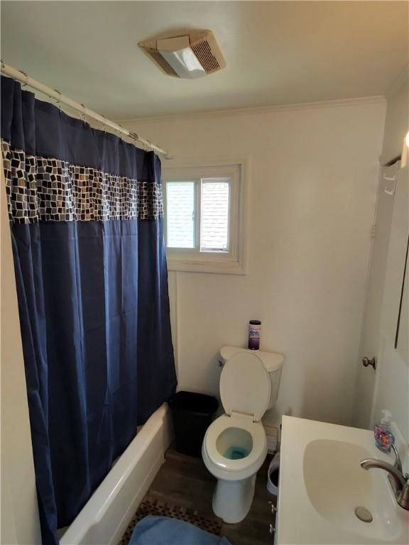 1131 13th St, Mckees Rocks, PA 15136 - bathroom with a sink, toilet, ornamental molding, and shower / tub combo